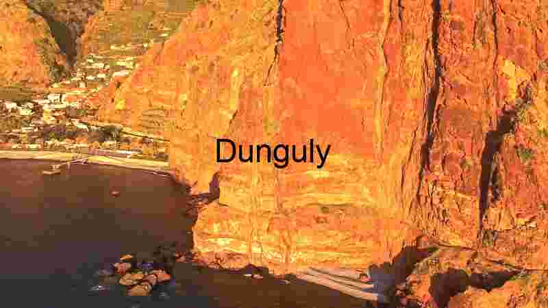 Rocky cliff near blue sea