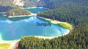 Tranquil Alpine Lake Amidst Rugged Peaks