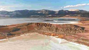 A Panoramic View of a Tranquil Lake and Surrounding Mountains
