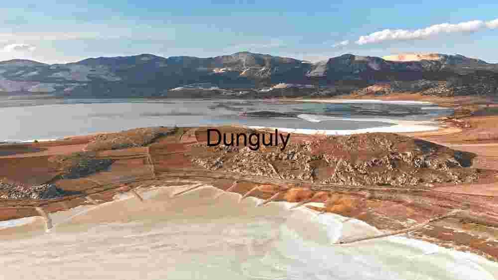 A Panoramic View of a Tranquil Lake and Surrounding Mountains