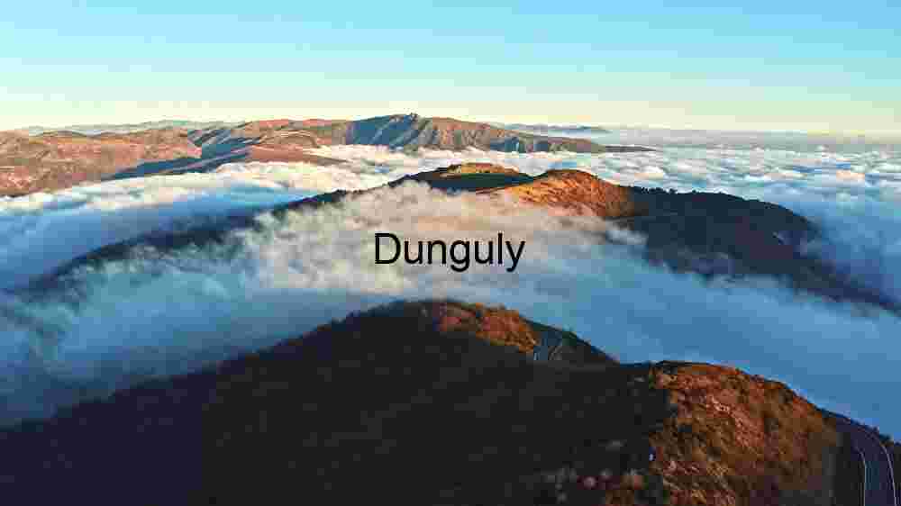 Sunrise Serenity: Majestic Peaks Above the Clouds