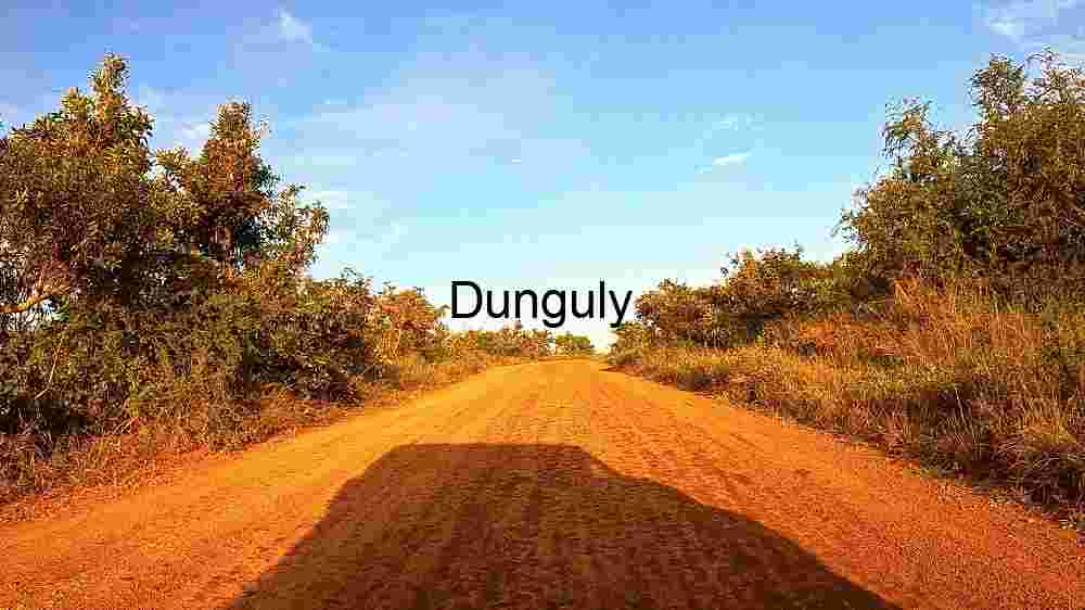 Rustic Charm: A Dusty Country Road at Sunset