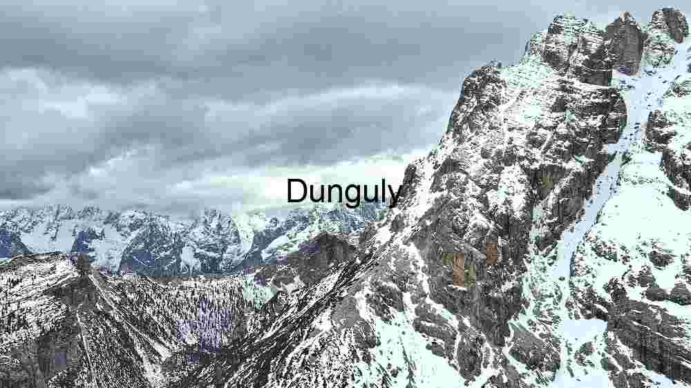 Majestic Alpine Peaks Under a Cloudy Sky