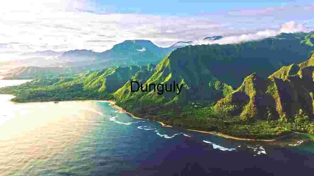 Tropical Paradise: Aerial View of Lush Green Mountains by the Sea