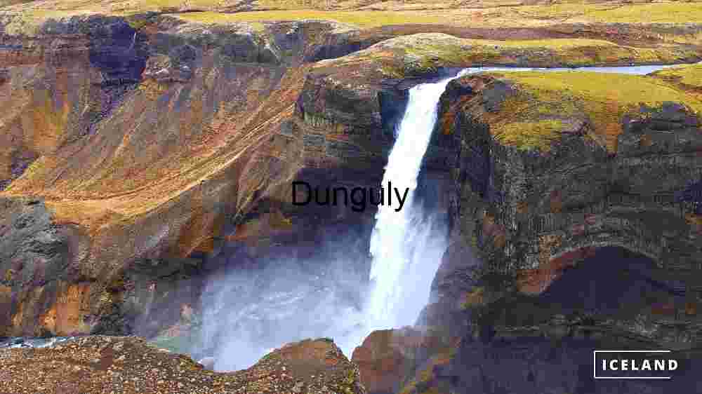 Majestic Waterfall in Iceland's Rugged Terrain