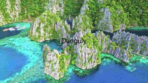 Tropical Serenity: Limestone Cliffs Meet Crystal Waters