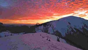 Sunset Symphony Over Snow-Capped Red Peaks