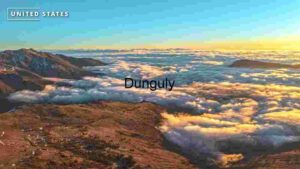 Sunset Over Mountainous Terrain and Clouds