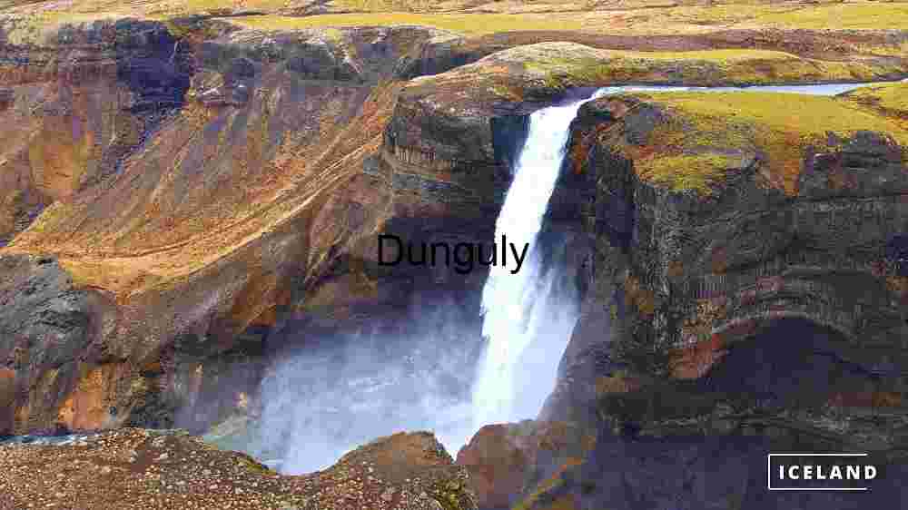 Majestic Waterfall in Iceland's Rugged Terrain