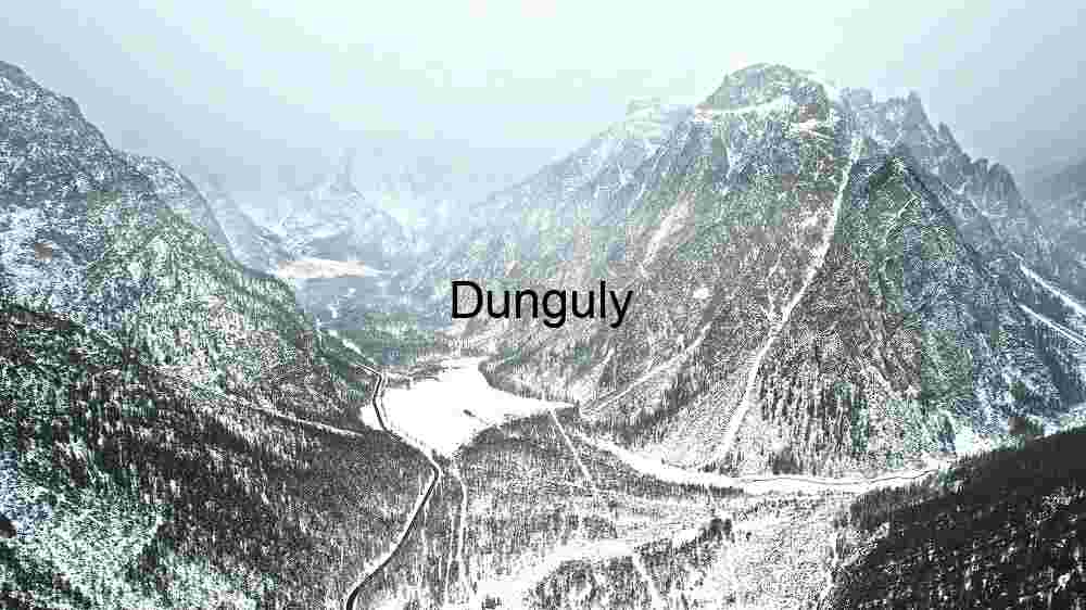 Winter’s Majesty: A Snow-Cloaked Mountain Valley