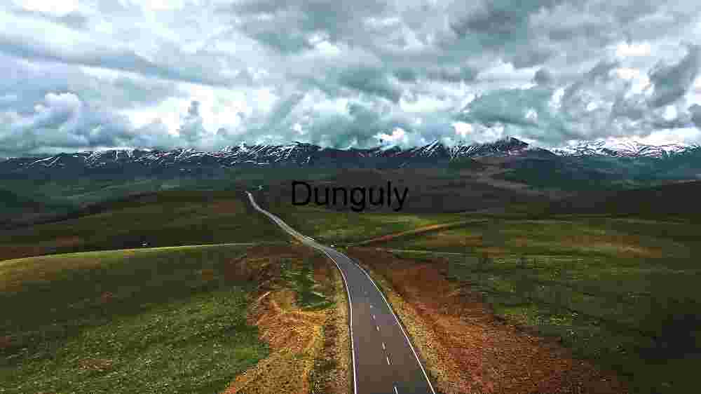 Serene Mountain Road Under Dramatic Skies
