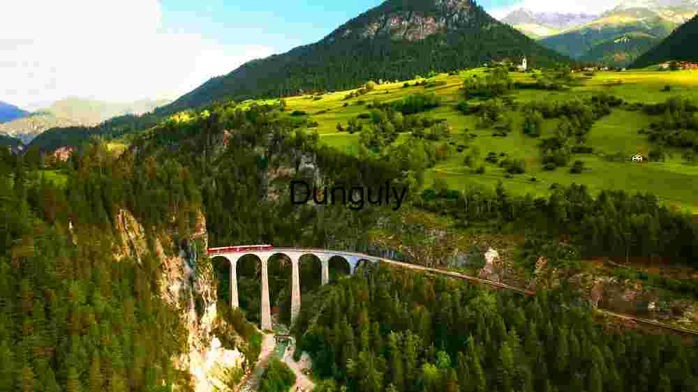 Verdant Alpine Valley with Historic Viaduct