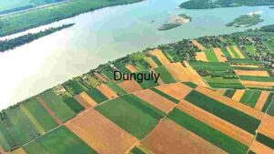 Aerial View of Patchwork Farmland by the Lake