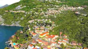 Aerial View of a Lakeside Town Nestled in Lush Greenery