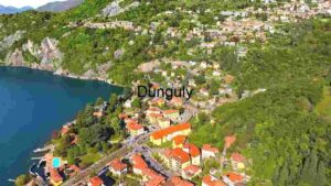 Aerial View of Lakeside Town Nestled in Lush Greenery
