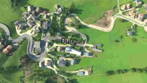Aerial View of a Serpentine Road in a Lush Green Landscape