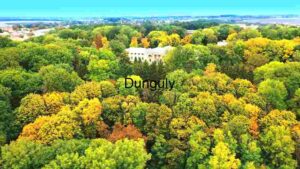 Autumnal Aerial View of a Lush Forest with a Classical Building