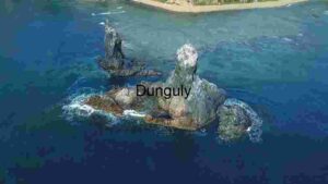 Coastal Elegance: Aerial View of Rocky Outcrops in the Ocean