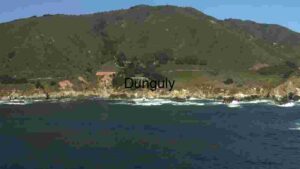 Coastal Serenity: A Panoramic View of Rugged Cliffs and Tranquil Waters