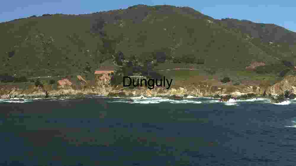 Coastal Serenity: A Panoramic View of Rugged Cliffs and Tranquil Waters