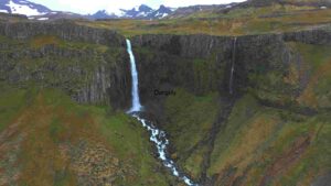 Majestic Waterfall in a Lush Green Landscape