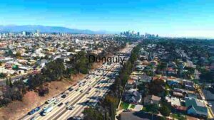 Aerial View of Bustling Cityscape and Highway
