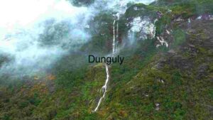 Majestic Waterfall Amidst Misty Mountains