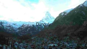 Alpine Village at the Foot of Snow-Capped Peak