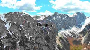 Majestic Mountain Peaks Under a Cloudy Sky