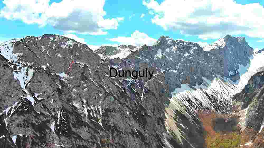 Majestic Mountain Peaks Under a Cloudy Sky