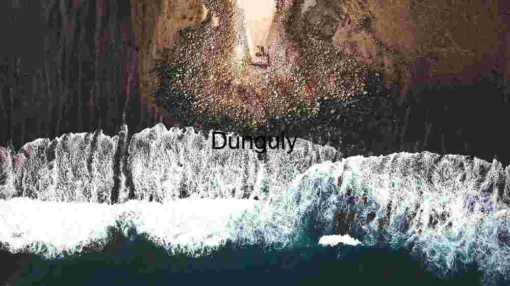 Aerial View of Crashing Waves on Rocky Shoreline