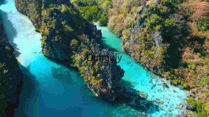 Aerial View of a Turquoise River Winding Through a Lush Green Canyon