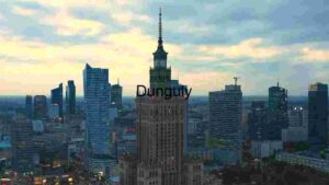 Modern Cityscape with Iconic Tower at Dusk