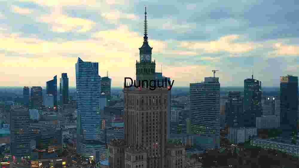Modern Cityscape with Iconic Tower at Dusk