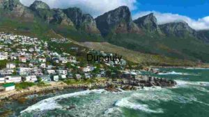 Enchanting Coastal Town with Mountain Backdrop