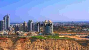 Modern Urban Skyline Overlooking Coastal Cliffs