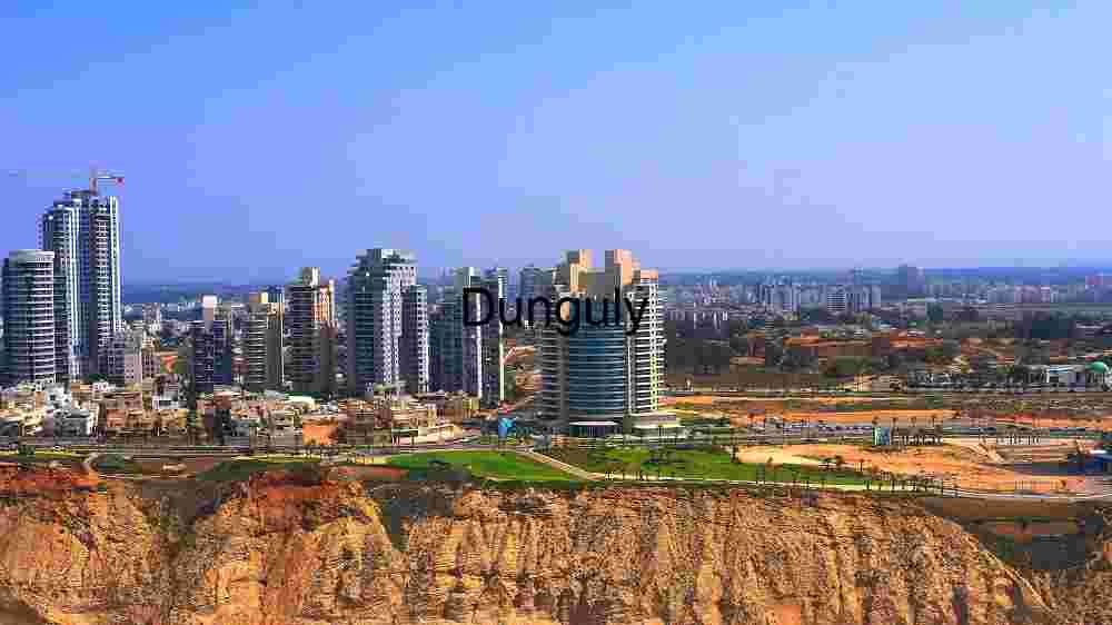 Modern Urban Skyline Overlooking Coastal Cliffs