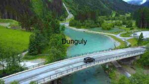 Scenic Bridge Over Turquoise River in Mountainous Landscape