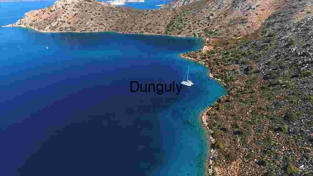 Serene Coastal Landscape with Anchored Sailboat