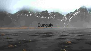 Majestic Mountain Range with Black Sand and Sparse Vegetation