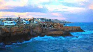 Coastal Cliffside with Camper Vans at Sunset