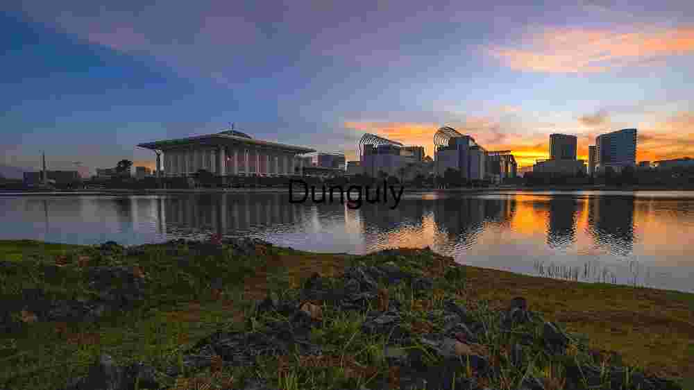 Sunset Over Modern Architecture by the Lake