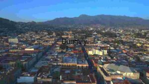 Aerial View of a Vibrant Cityscape with Mountain Backdrop