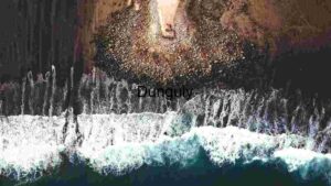 Aerial View of Rocky Shoreline and Ocean Waves