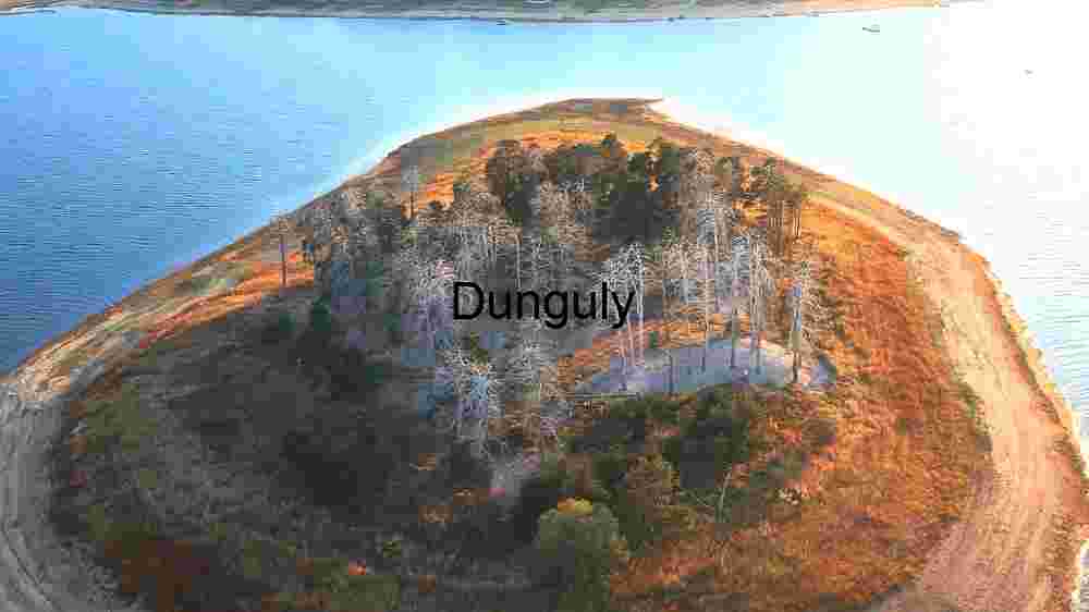 Aerial View of a Small Forested Colourful Island