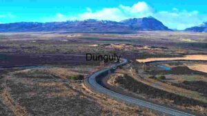 Serene Mountain Road with River and Vast Landscape