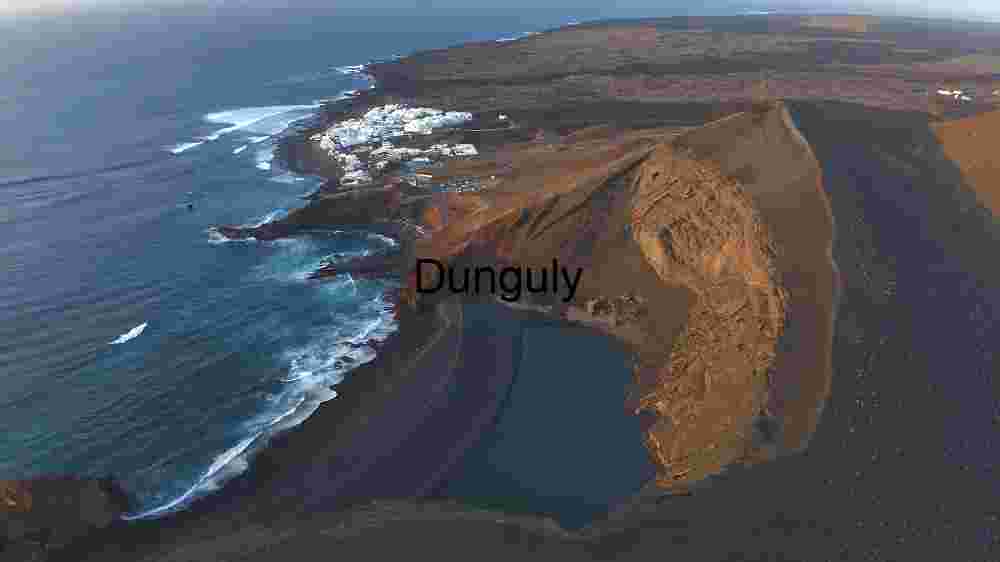 Aerial View of Coastal Town and Volcanic Landscape