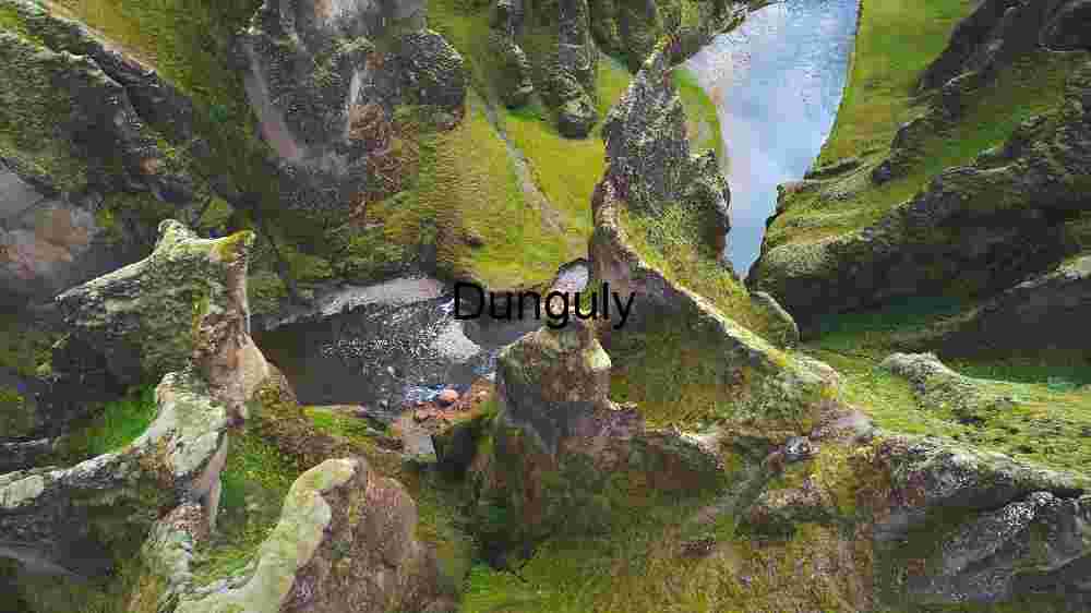 Majestic Canyon with Moss-Covered Cliffs and Serene River