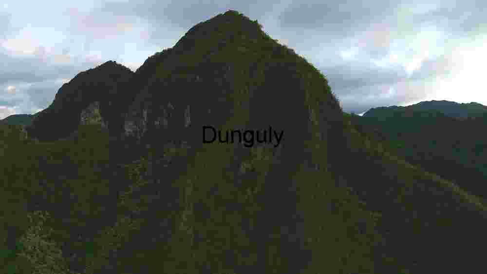 Majestic Verdant Mountain under Clouded Skies