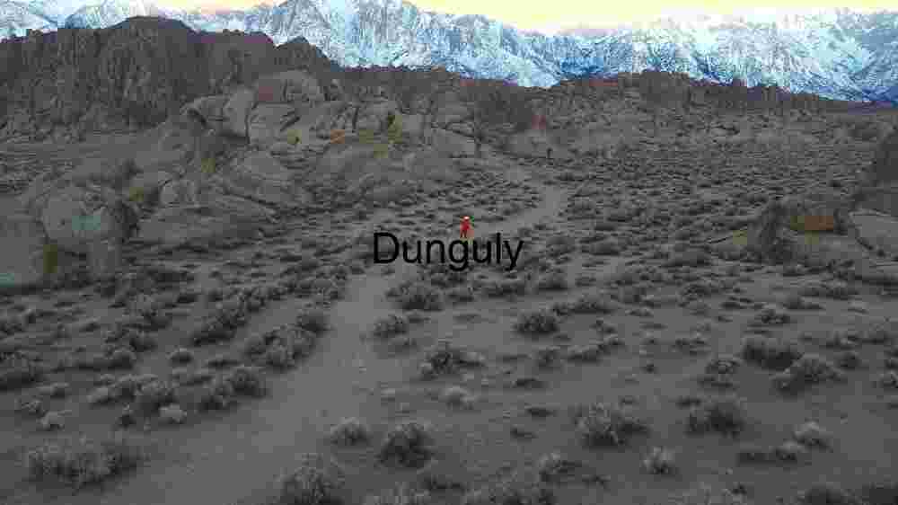 Lone Traveler in Rocky Desert Landscape